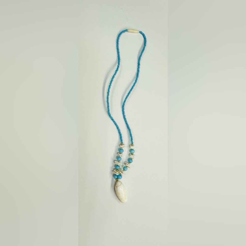 handmade turquoise beaded necklace with a shell pendant